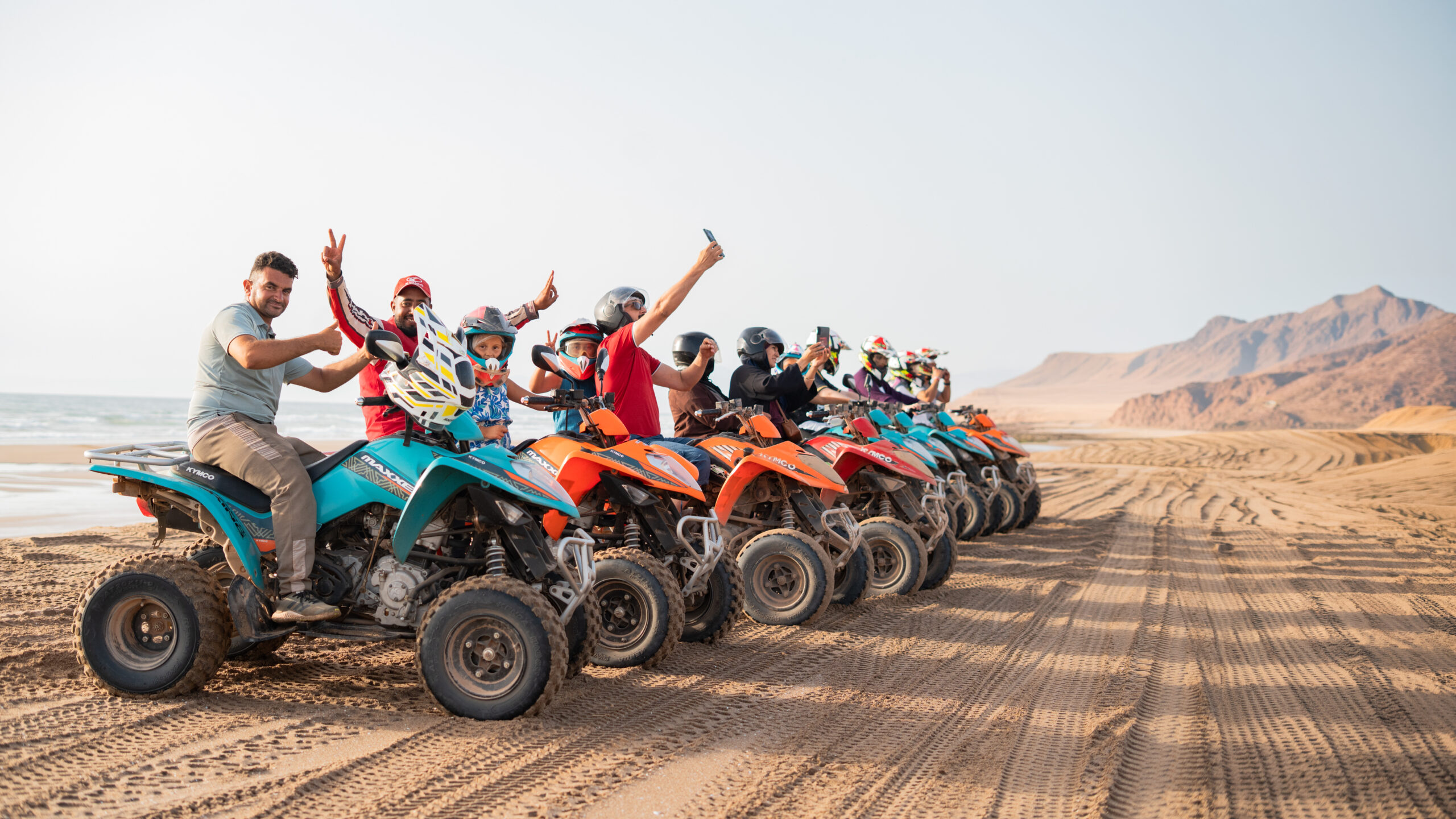 Riders together on a coastal route